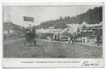 The Midway Richmond County Fair, Staten Island  (Concession Stands, people walking about, stadium and Painless Parker's cart  in middle of road.