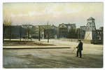 Truck No. 1 & Fire Bell, Stapleton, Staten Island [man posed in street, fire bell tower, horse & carriage, truck #1 not in picture]