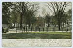 Washington Park and Village Hall, Stapleton, Staten Island  [view of park with old brick village hall and many men strolling the paths]