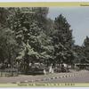 Stapleton Park, Stapleton, Staten Island, N.Y. [view from street, benches along edge of park with woman and children]