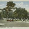 Public Park, Port Richmond, Staten Island, N.Y. [view of park with people on sidewalk and old touring car on street]