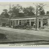 Railroad Station, Eltingville, Staten Island, N.Y. [old cars at R.R. crossing, people on sidewalk in front of Eltingville Pharmacy with sign for soda and "Reid's" ice cream]