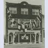 U.S.S. Staten Island Club, 98 Beach Street, Stapleton, S.I., N.Y. [building ext. draped with semaphore flags and sign 'United Seamen's Service, Inc., Staten Island Club']