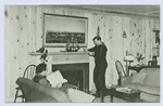 Staten Island Center for Active Service Men, Stapleton, Staten Island, N.Y.  [int. view of living room with sailor leaning on mantle and another man on sofa]