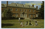 Notre Dame College [ext. with girls sitting on lawn reading and others on steps and walking, info about the school on back]