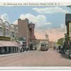 Richmond Ave. Port Richmond, Staten Island, N.Y. [trolley, old cars, people walking, shops on both sides of street, shop selling 'Victrolas', Palace theater]