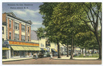 Business Section, Stapleton, Staten Island, N.Y.  [corner of park, with people in street, 40'scars parked in front of shops, F.W. Woolworth, Co., Miles shoes]