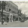 Amboy Road, Great Kills, Staten Island, N.Y.  [old cars in street, shops and sign behind telephone pole that appears to be 'Light, Power...  Gas...Electric']