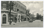 Amboy Road, Great Kills, Staten Island, N.Y.  [old cars in street, shops and sign behind telephone pole that appears to be 'Light, Power...  Gas...Electric']