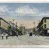 Richmond Turnpike, Tompkinsville, Staten Island,  N.Y.  [great view of street with people, markets, old car, trolley tracks, shops with awnings, Plaza Market on Corner]