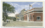 Bay Street from Canal Street, Stapleton, Staten Island, N.Y.  [boys in knickers on street, trolley car, shops on one side of street, edge of  Washington Park on other side]