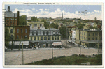 Tompkinsville, Staten Island, N.Y.  [interesting view of shopping area from high ground, trolley tracks on brick street, horse and wagon, striped awning over corner store]