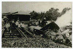 Wreck at P.B.S.I. July 13, 1910  [train wreck with men sitting on tracks and on overturned train]