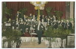 Vincent Catanese Orchestras  [ 'big band' orchestra in tuxedoes posed with instruments on decorated bandstand]