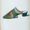 [Mule or bedroom slipper in green velvet, with coat of arms embroidered in silk and metallic threads, made by Abrahams, Westbourne Grove, W.]