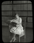 Library for the Blind, girl reading The Velveteen Rabbit in the loan collection at New York Institute for the Blind, May 1926.