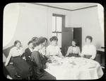 Melrose Branch, women sitting around table with table cloth, Jan. 10, 1914.