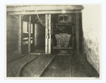 Shaft bottom, showing concrete side walls and steel "I" beams in walls and arch