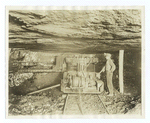 Miner and machine in a mine