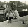 Man using electric cloth cutter