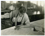 Man using electric cloth cutter