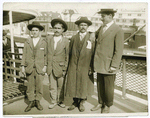 Armenian refugees rescued from Turks by French cruiser arrive in New York, March 9th. 14 year old Peter Gragosian, and three leaders of the refugees arriving in this country.