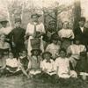 Typical group of Gary, Indiana school children. Top row standing : left to right, Greek, Negro, Roumanian, Lithuanian, Italian, Polish, Croatian, Hungarian. Middle row, American, Austrian, German, Bulgarian, front row, Scotch, Russian, Irish, Assyrian, Slavish, Jewish and Spanish. Do these children look American?