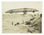 Traveling ore bridge or crane, storage yard