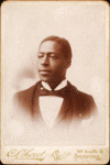 Studio portrait of man in formal attire.