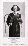 Postcard of Dr. Thomas L. Johnson, author of 'twenty-eight years a Slave, pictured holding a whip and shackles.