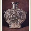 Gourde plate en terre émaillée. H. 200 mm., L. 180 mm. (Chine. Début de la dynastie Tang)