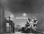 Scene with Louis Wolheim as Robert Smith "Yank". Harold McGee as a Secretary (extreme left).