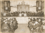 Mr. Richard Bell, M.P., addressed a mass meeting of railwaymen at Battersea Town hall last night. In the photograph Mr. Bell (marked with a cross) is seen seated at the table. The gentleman standing on his left is Mr. F C. Fagg, who opened the meeting ('Daily Mirror' photograph)