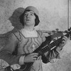 Alfred Lunt as Marco Polo, with a guitar.