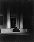Alice Brady as Lavinia Mannon (seated on the steps of Mannon Mansion.)