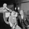 Grant Mills (standing) as Jerry Hyland, Jean Dixon as May Daniels and Hugh O'Connell (seated) as George Lewis. Scene: On a Pullman car