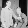 Alfred Lunt as Raphael Lord and Douglass Montgomery as Douglas Carr (seated).