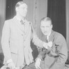 Alfred Lunt as Raphael Lord and Douglass Montgomery as Douglas Carr (seated).