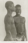 Two Dç men: the one on the right shows missing incisor tooth in upper jaw.