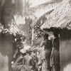 The entrance into a Vai town of the "Femba," or women's devil.