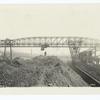 10-ton electrically operated ore re-handling bridge, span 238', tower cantilever 90', shear leg cantilever 50'. Also showing two 10-ton electrically operated Hulett automatic ore unloaders.