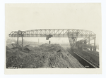 10-ton electrically operated ore re-handling bridge, span 238', tower cantilever 90', shear leg cantilever 50'. Also showing two 10-ton electrically operated Hulett automatic ore unloaders.