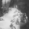 Chinese coolies on the quay in the harbor scene from "Roar China." Setting by Lee Simonson.
