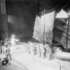 Edward Trevor (in white uniform) mate of H.M.S. "Europa" directing Chinese coolies in scene from "Roar China." Setting by Lee Simonson.