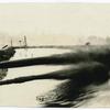 Two oil pipelines spewing oil into an oil lake