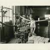 Filling ½ gallon cans of motor oil at the East Chicago refinery of the Sinclair Refining Co. When the can is full the oil is automatically shut off.