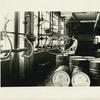 Lubricating oils are shipped in drums barrels, cans and tank cars. Filling barrel at the East Chicago refinery of the Sinclair Refining Co.