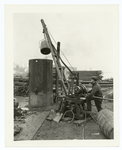 Handling dirty launching grease by means of "the little tugger" hoist. At the rendering plant of the Sun Shipbldg. Company, "the little tugger" hoist has simplified and reduced the labor charge for this work.