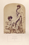 Kurumbars,  Nieelgerries. (men, one standing and one sitting)