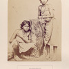 Kurumbars, Neelgerries. (two women, one sitting)